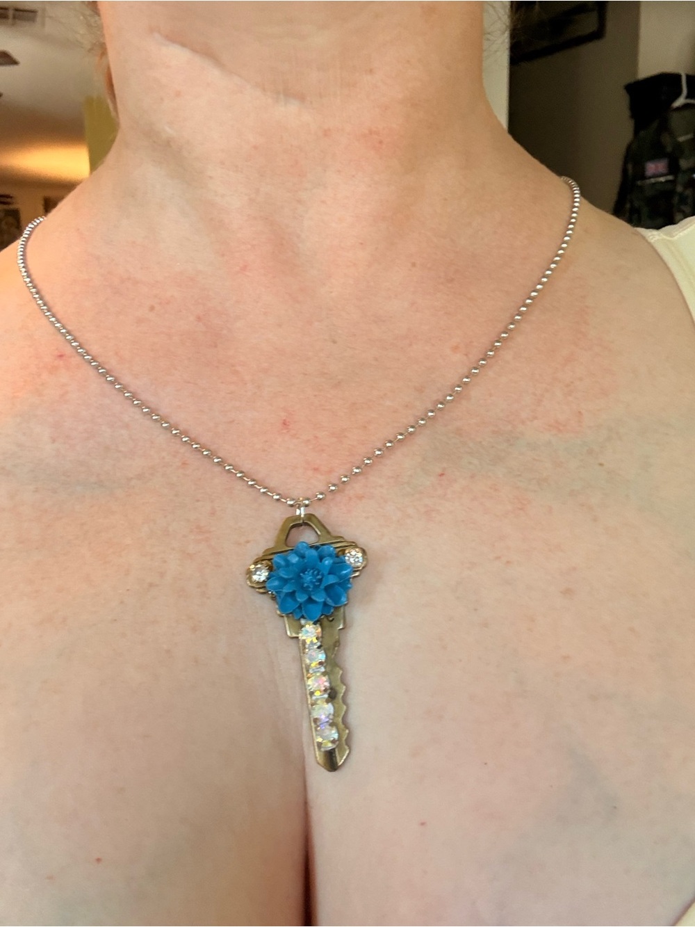 Silver Key Pendant Necklace with Blue Flower Accent